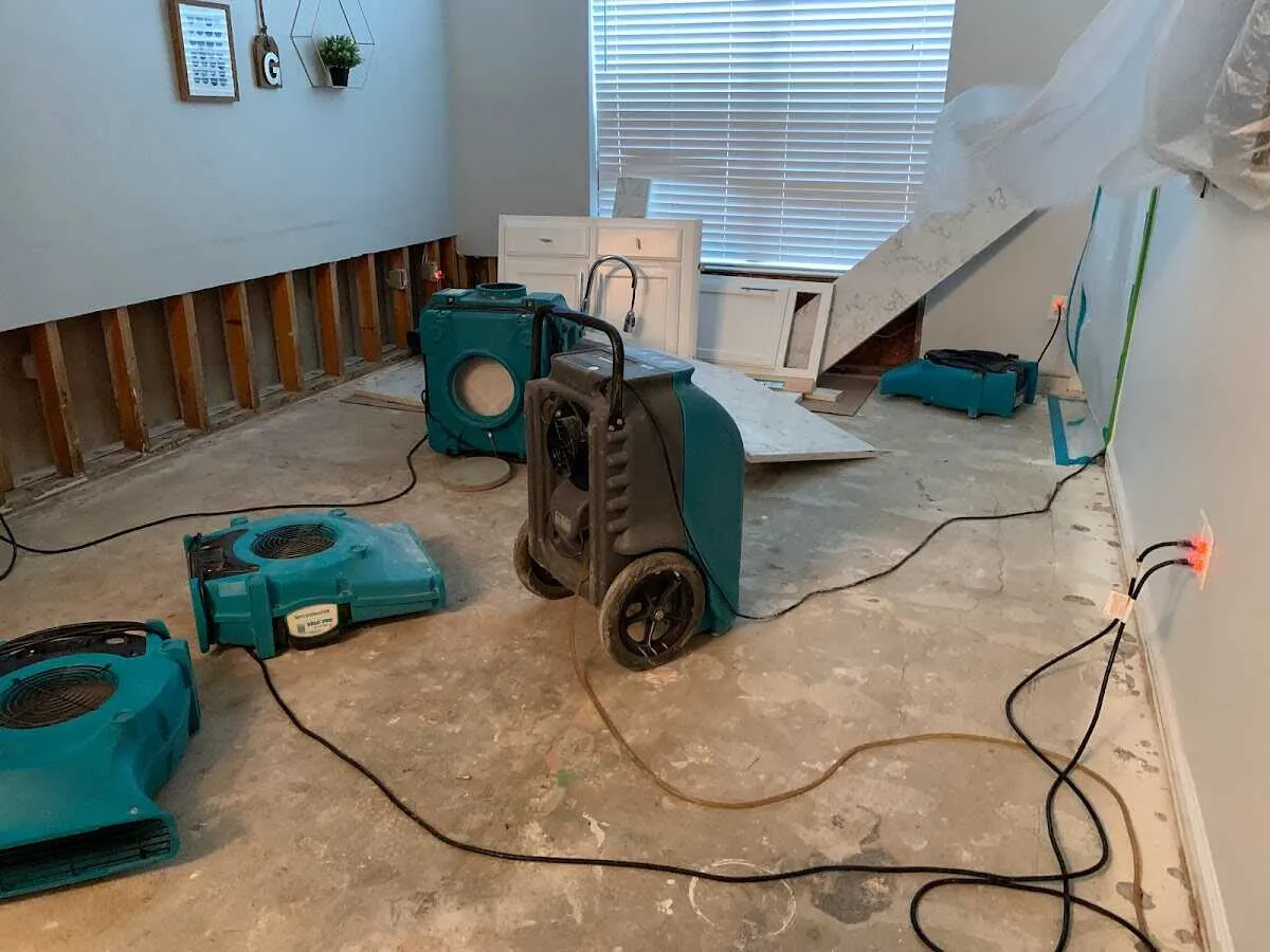 Dehumidifier in flood-cut room for Water Damage Restoration in Port Jefferson